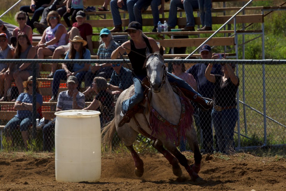 Lyndsey Rosychuk alternated between teaching and riding during the barrel racing.