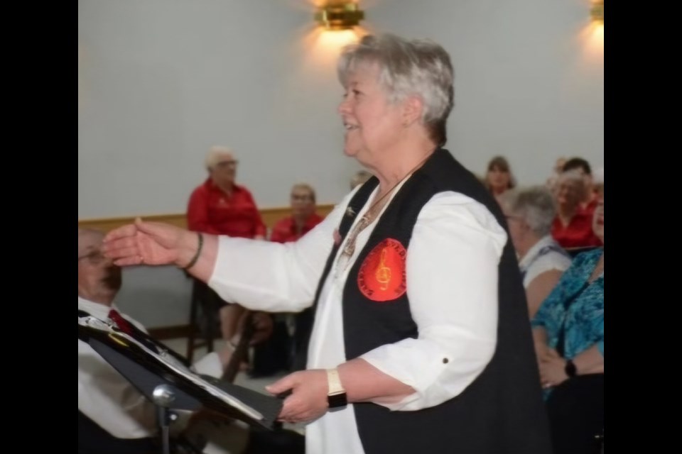 Donna Strydrorst, Versatile Choir director leads the choir in a fantastic number.