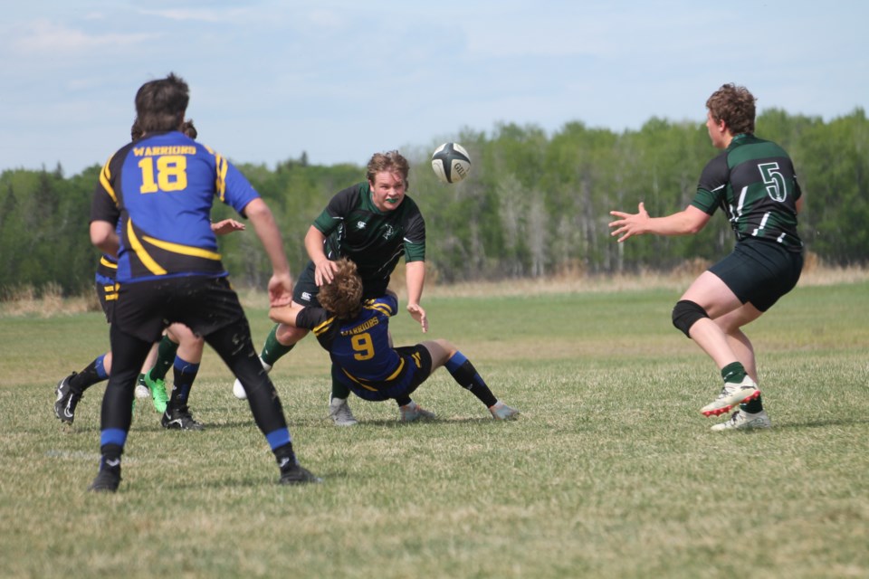 Desmin Dunience dishes the ball to Wyatt McKinnon during the Predators 15-14 win over Drayton Valley. The game would go on to be the deciding factor in EPC's qualification to provincials, with Drayton finishing in second place. 