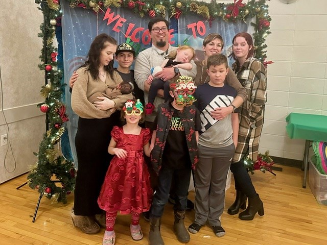 Dylan George with his family. Justice (holding her daughter), Brock, Dylan ( holding granddaughter), Kyla, Tapanga (mother to the one I’m holding). 
Front left to right:
Arabella, Luke, Heath. Photo supplied by Dylan George.