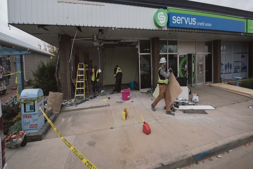 Alleged suspects in a series of ATM thefts from communities across Alberta were apprehended by RCMP in Rochester Nov. 16 after an extensive year-long investigation. This was the scene at the Legal Servus Credit Union on the morning of Sept. 30 after a flatbed truck rammed into the building, loaded the ATM, and fled.
JOHN LUCAS/St. Albert Gazette