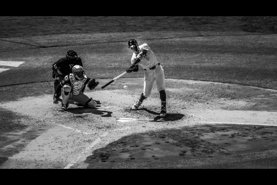 Mitch McGarva smuggled in his zoom lens into Yankee Stadium to take this photograph of a New York Yankee at bat.