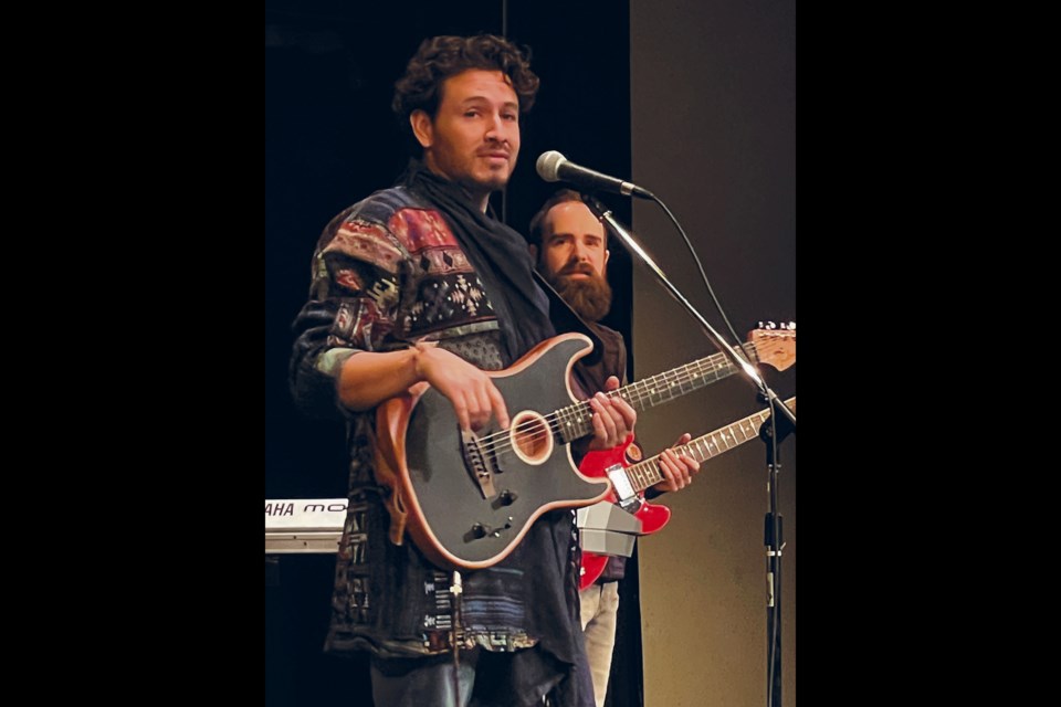 Columbian-born singer Cristian de la Luna, left, recounted to a lively audience at the Nancy Appleby Theatre Nov. 28 when his family first came to Canada 17 years ago. Every night the host would ask “Voulez-vous du gâteaux?” (Do you want cake?) and every night the family would refuse because in Spanish the word for cat is ‘gato’ so they wondered at this strange Canadian tradition of asking people if they wanted cats after a meal. A tongue-in-cheek story to be sure, and one of many de la Luna told over the evening between singing in French, English, and Spanish. One of his three band members, guitarist and keyboardist Raphael Freynet, is seen on the right.  The Heartwood Folk Club will be starting up with a limited four-performance run in the spring and you can subscribe to their newsletter at heartwoodfolkclub.org to stay informed. 