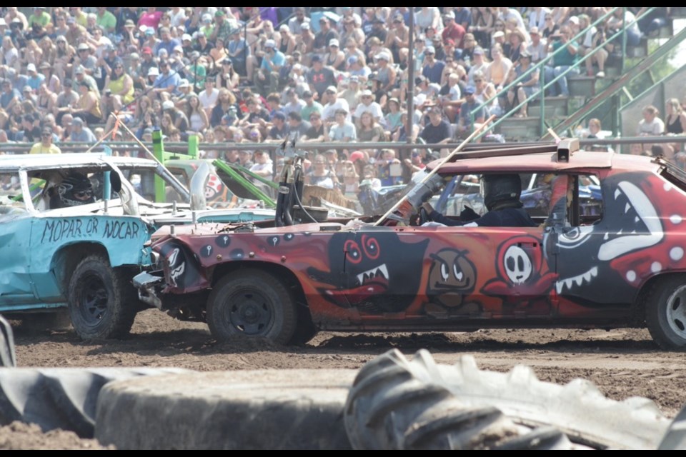 Some of the entries in the 2023 Demo Derby had elaborate paint jobs as they vied to win a best-dressed contest, such as the car on the right decorated with a Super Mario theme.