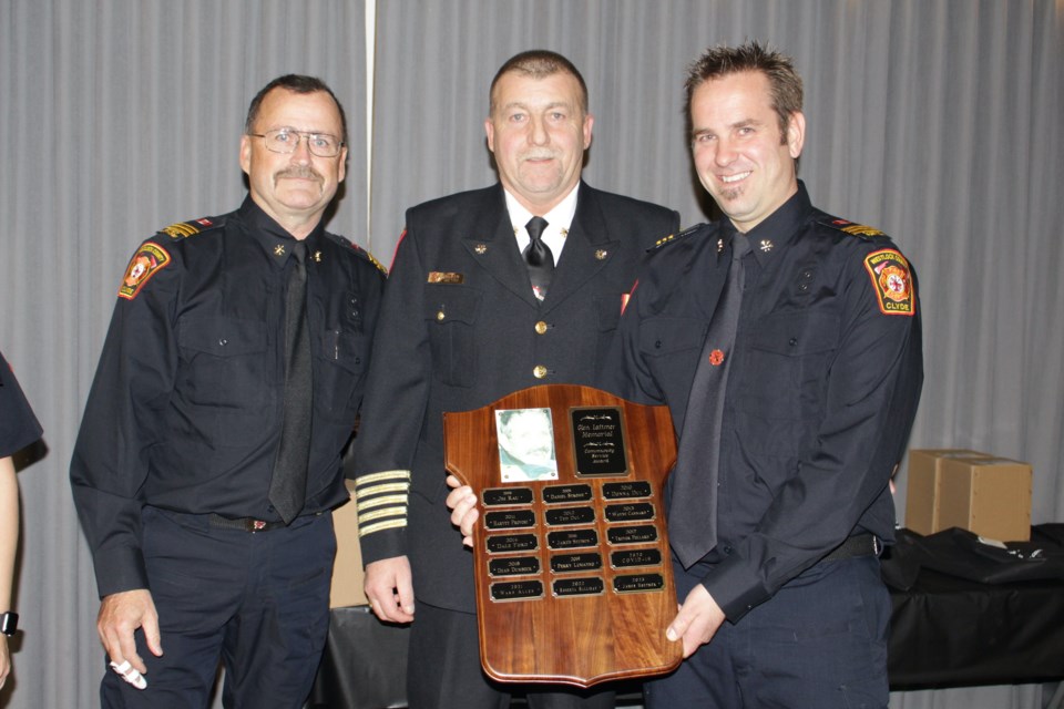 Station 4 (Clyde) fire chief James Hoetmer, right, is presented the Glenn Latimer Memorial Community Service Award during the Westlock County fire awards banquet on Nov. 4. To Hoetmer's left is Station 4 deputy chief Perry Lumayko and manager of protective services John Biro.