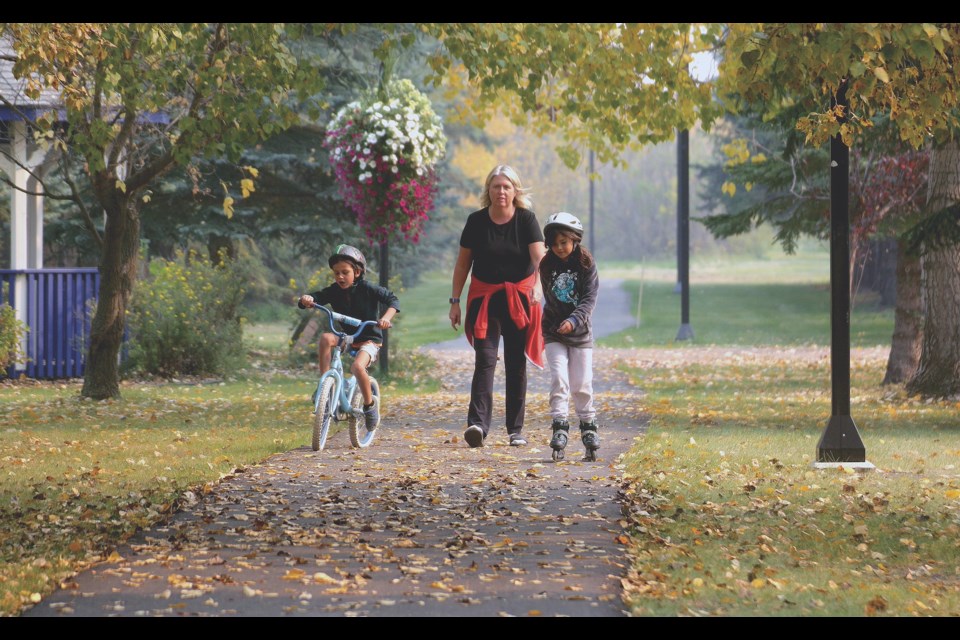 The Johnston family was one of many who took part in the annual Terry Fox Run hosted in Westlock Sept. 17 while enjoying the beautiful fall colours along the Rotary Trail. From left to right are Wowa Johnston, Janice Johnston and Fonzie Johnston.   