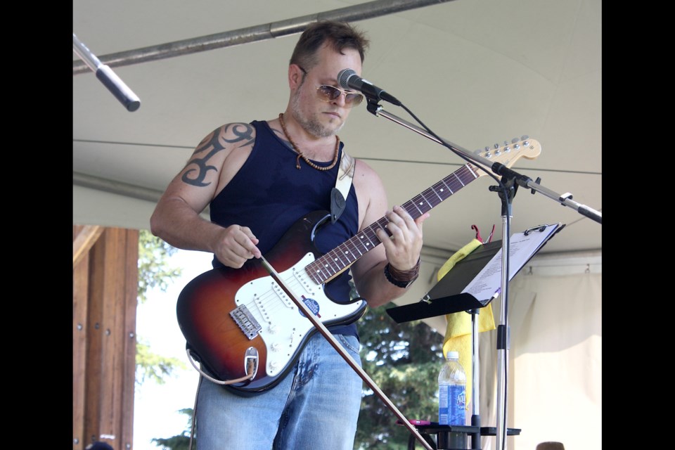 Adri Chem, aka Nurse Adrian, aka Adrian Chmil, was channeling Jimmy Page as he took the violin bow to his trusty Strat.