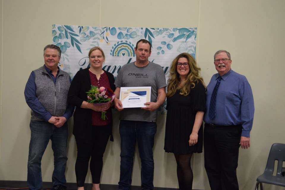 Town of Barrhead mayor Dave McKenzie (far right), County of Barrhead reeve Doug Drozd (far left), with Pembina Hills School Division trustee Victoria Kane (second from the right) present Anja and Dennis Donkers with the Long-standing Service Volunteer Award.