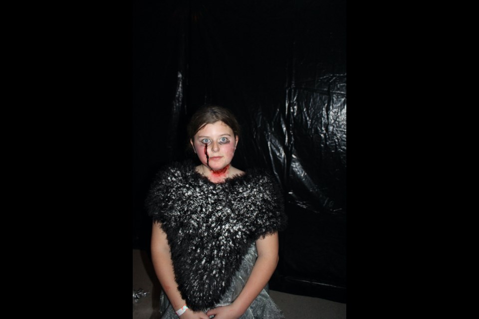 Aspyn Brodersen played one of the zombies or monsters that popped out to scare haunted house patrons.