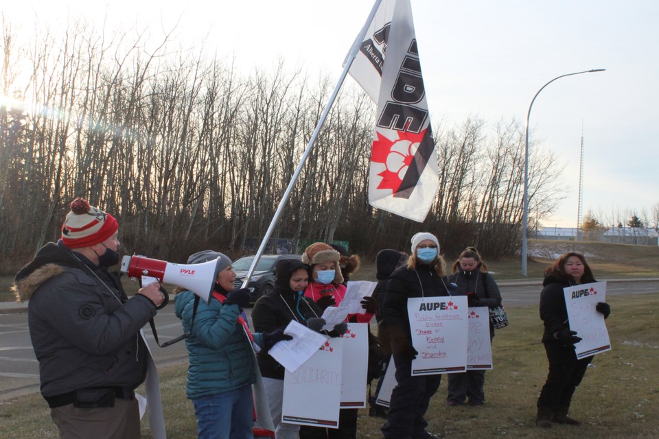 5. AUPE vice-president Mike Dempsey (holding megaphone) walked with healthcare workers from Athabasca, picketing outside the Athabasca Healthcare Centre and the health unit Oct. 26. Healthcare workers across Alberta went out on strike in reaction to Alberta Health Minister Tyler Shandro's announcement that 11,000 workers would be laid off. 