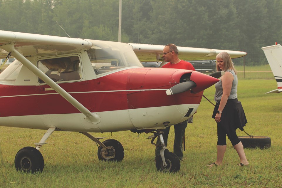 Graham and Tammi Douglas took the opportunity to get a close-up view of some of the planes that pilots had flown in for the event.