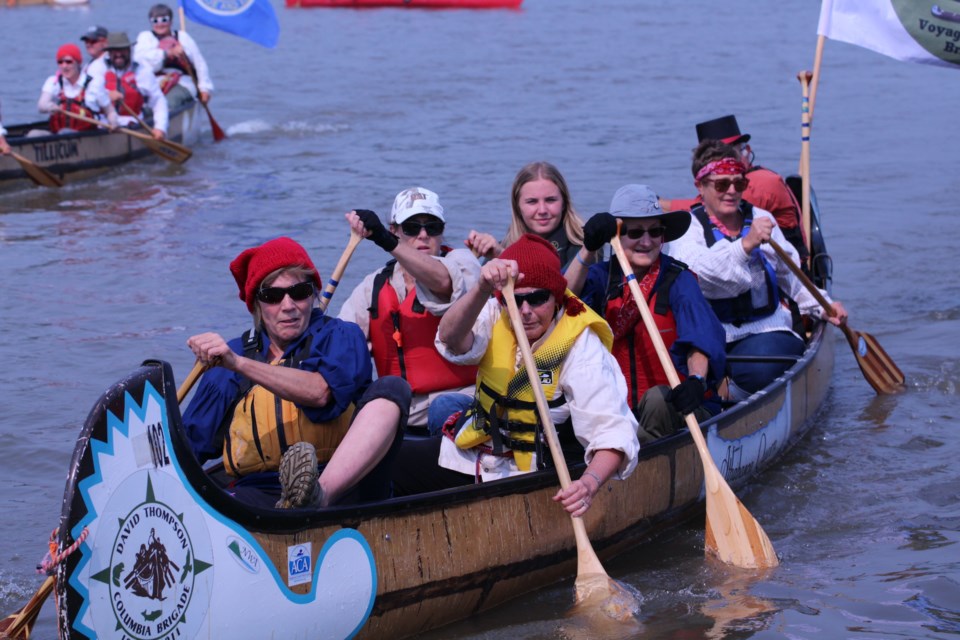 A small army of modern-day voyageurs came ashore at the Athabasca riverfront July 13, which was the final stop for the brigade that started in Whitecourt and was celebrating Fort Assiniboine’s bicentennial anniversary. The paddlers covered 343 kilometres over the six-day journey, before being welcomed by local dignitaries, community figures, and maybe most importantly, dinner. PICTURED: Rick Zrobeck, of the Canadian Voyageur Brigade Society, worked the stern of one of the 13 canoes that finished the journey in Athabasca. Zrobeck said that a major goal for the trip was to pass on their knowledge to the next generation, and in that regard, he considered the trip a resounding success.