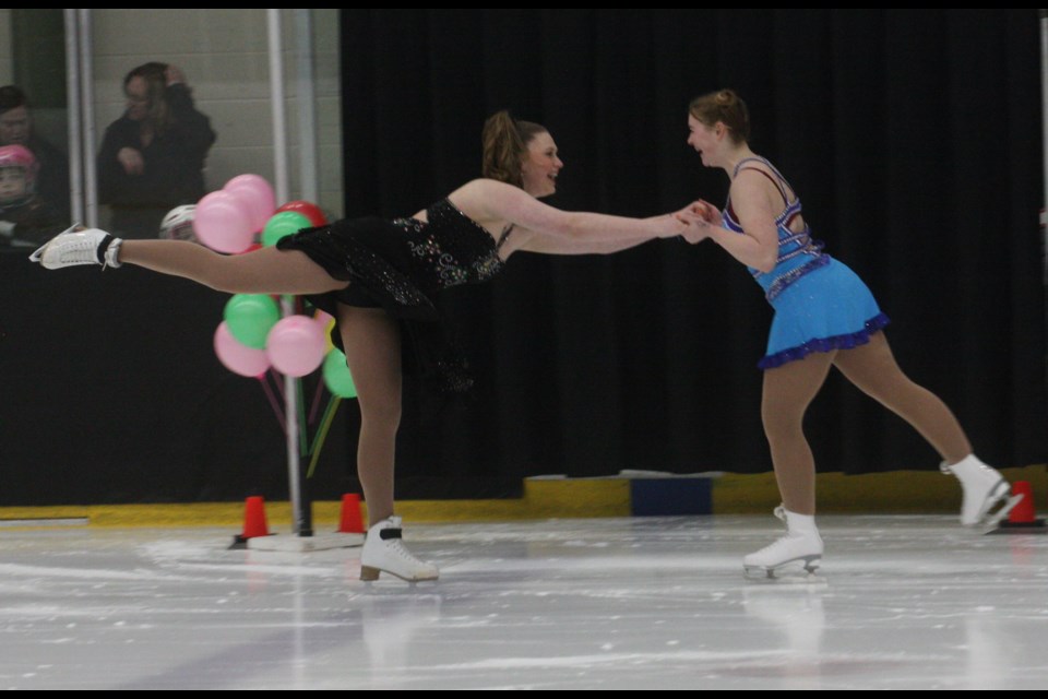 Maia Erderly and McKenzie Richard link up during their duo piece to Roy Orbison’s “Pretty Woman”.