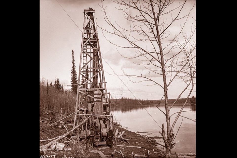 A historical picture, from the Athabasca Landing: An Illustrated History book, of the well drilled by A.W. Williams, as it was in 1894 before it was abandoned in 1896.