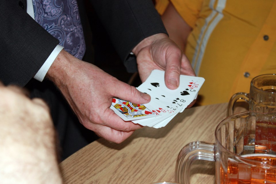 Getting up close and personal Ron Pearson, a magician from Edmonton, delighted audience members as he made rabbits appear and disappear and pulled out the correct card every time.
Heather Stocking/AA