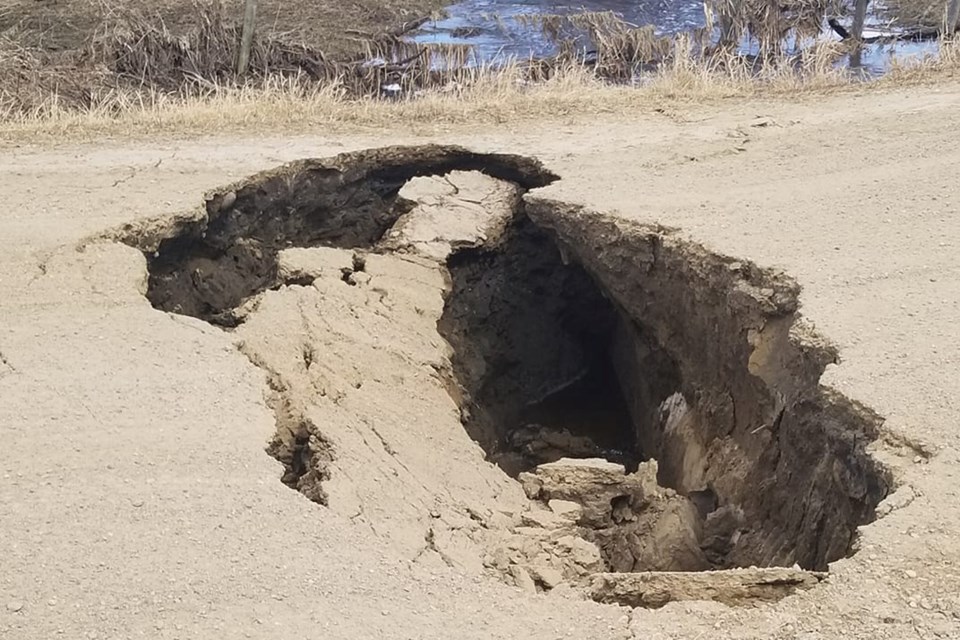 On April 22 Steven Larson posted this photo on social media of the start of a washout on the east side of the intersection at Township Road 644 and Range Road 200 southwest of the Village of Boyle. 
Steven Larson/Supplied 