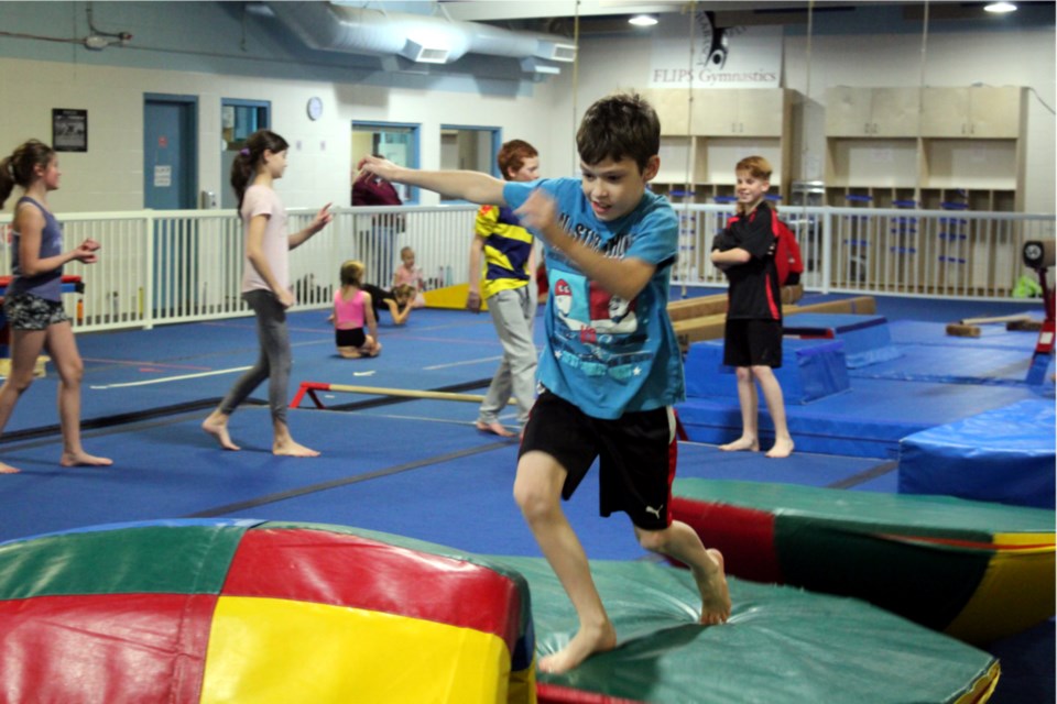 Rexson Turner ran the course at FLIPS Gymnastics Club Nov. 5 in the Ninja Warriors advanced class while Ali Sawchuk, Kadence Arychuk, Ryder Silkie and Noah Cyr waited their turn. The club reopened in September following AHS guidelines.
Heather Stocking/AA