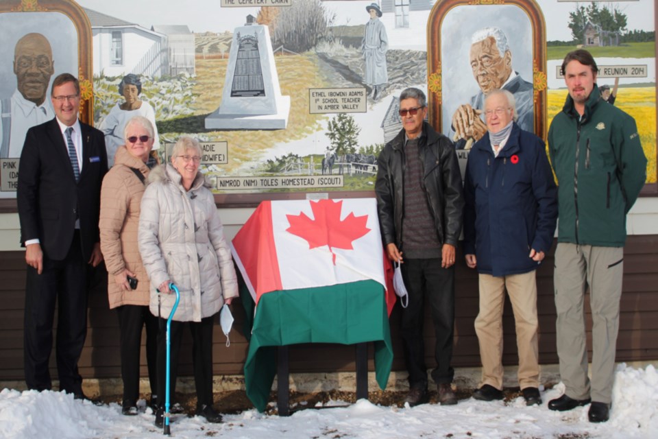 (L-R): Athabasca-Barrhead-Westlock MLA Glenn van Dijken, Athabasca County Coun. Doris Splane, Town of Athabasca mayor Colleen Powell, Amber Valley Community Association president Gil Williams, Athabasca County reeve Larry Armfelt and Parks Canada – Elk Island supervisor Dale Kirkland prepare to unveil the cleaned up and restored plaque Nov. 15. The plaque was approved to be placed outside Amber Valley Hall after it was knocked off its stand last winter at its former location on Highway 55 east of the hall.
Heather Stocking/AA 