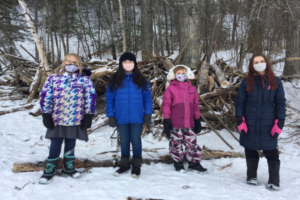 (L-R) Makila Lowe, Isabella Arellano, Mia Jodry and Farrah Kamelchuk make up the Woodland Kids council, chaired by Kamelchuk, to help mediate disputes that arise between forts and wok out a binding compromise. 