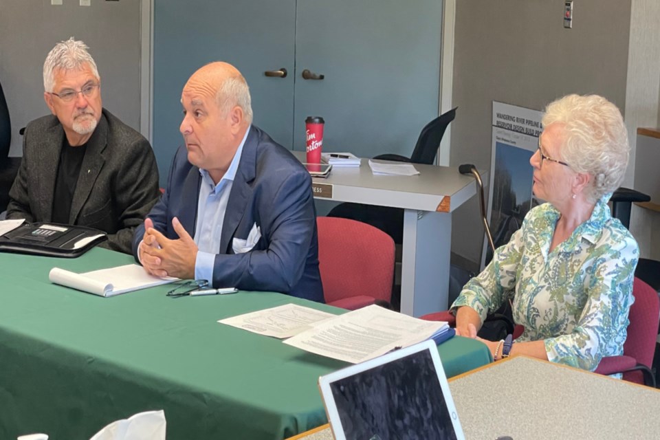 Keep Athabasca in Athabasca University ad hoc committee members Brian LeMessurier (left) and Mavis Jacobs (right) spoke with Athabasca County council Aug. 26 along with lobbyist Hal Danchilla (middle) from the Canadian Strategy Group.