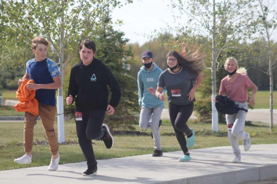 (L-R) Quinten McConnell, Evan Palmer, Beth Jensen, Avis Wagner and Luisa Newberry completed the final part of the Terry Fox run at Edwin Parr Composite Sept. 18. Grades 7 to 9 ran first and returned to hot dogs with all the fixings generously donated by Buy Low and drinks from Tipton’s Independent Grocers. Grades 10 to 12 set off around 12:30 p.m. also running the path south across the road from the school. 