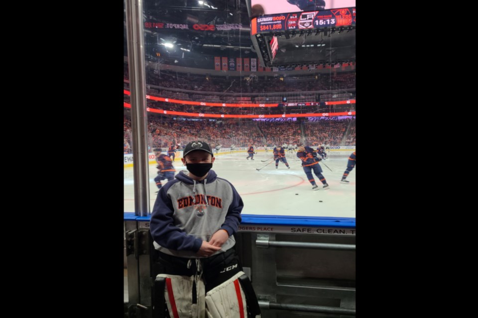 Boyle’s Karsten Porter was chosen to carry the Edmonton Oilers flag at the May 10 Oilers vs L.A. Kings playoff game. His father submitted his name, and he was randomly chosen. Here he stands at ice level as the teams warm up.