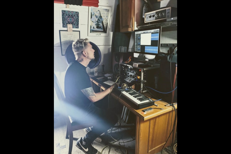 Dennis Habel, the guitarist and lead singer for local band 25 Cigarettes watches the levels while bands record in the studio set up in bandmate Fred Minville's barn near Colinton.