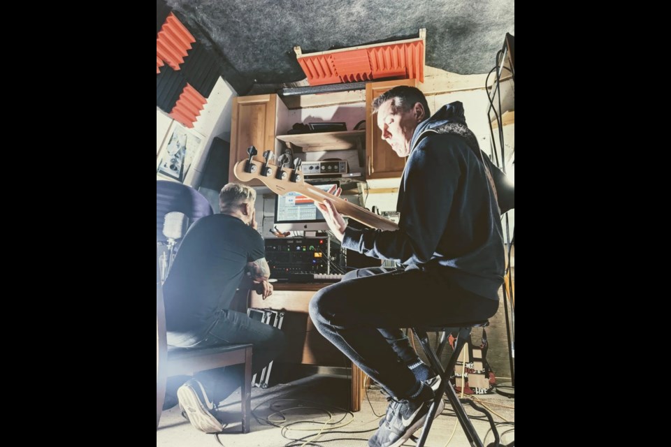 Two thirds of 25 Cigarettes, Dennis Habel and Rob Smith help out during recording BC based band Tea with Mara while they were in Athabasca over the July long weekend.