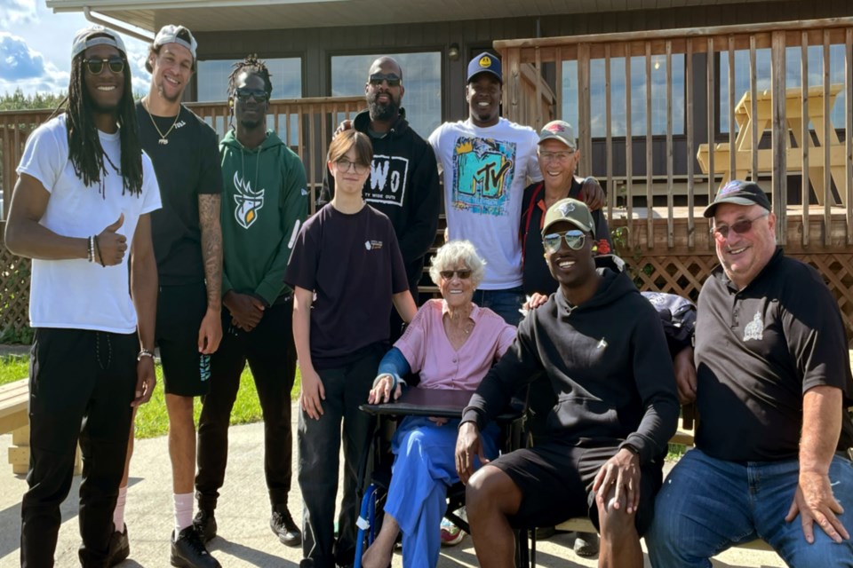 Rochester resident and ag society member Dwayne Rawson (right) introduced a few of the team to his parents who came out to watch. His mother, Doris Rawson, has two broken arms from a tumble a few weeks ago and the team complimented her on her perseverance and strength. 

(Standing L-R): Derel Walker, Adam Konar, Raphael Leonard, Emory Reid, Manny Arceneaux, Matthew Thomas, Ron Rawson 

(Sitting L-R): Doris, Christian Salsberry, Dwayne