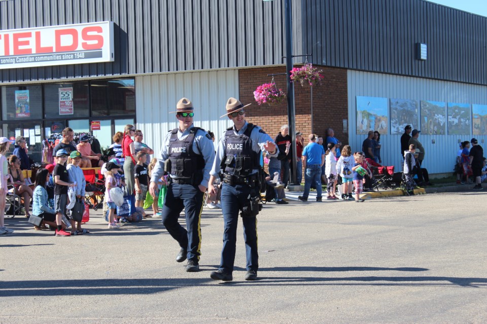 Members of the Boyle RCMP detachment lead the way of the Wildberry parade which featured everything from firetrucks to Wild Barry himself.