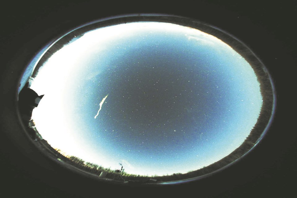 Athabasca University’s GeoSpace Observatory isn’t designed to pick up
meteors due to its light sensitive work to capture faint aurora, so when a
meteor burned up in the atmosphere Feb. 22, it was literally blinded, but
this shot of the glowing trail that was left behind after the flash was taken
about 20 seconds later.