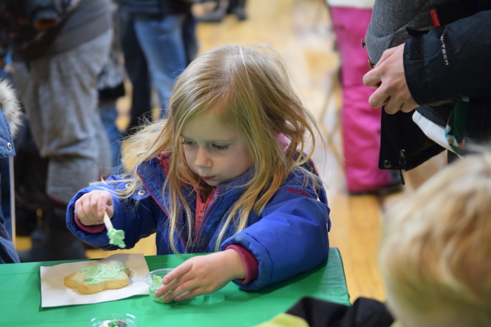 Almost four-year-old Aubrey Rutland, from Cherhill, decorates a Christmas cookie. 