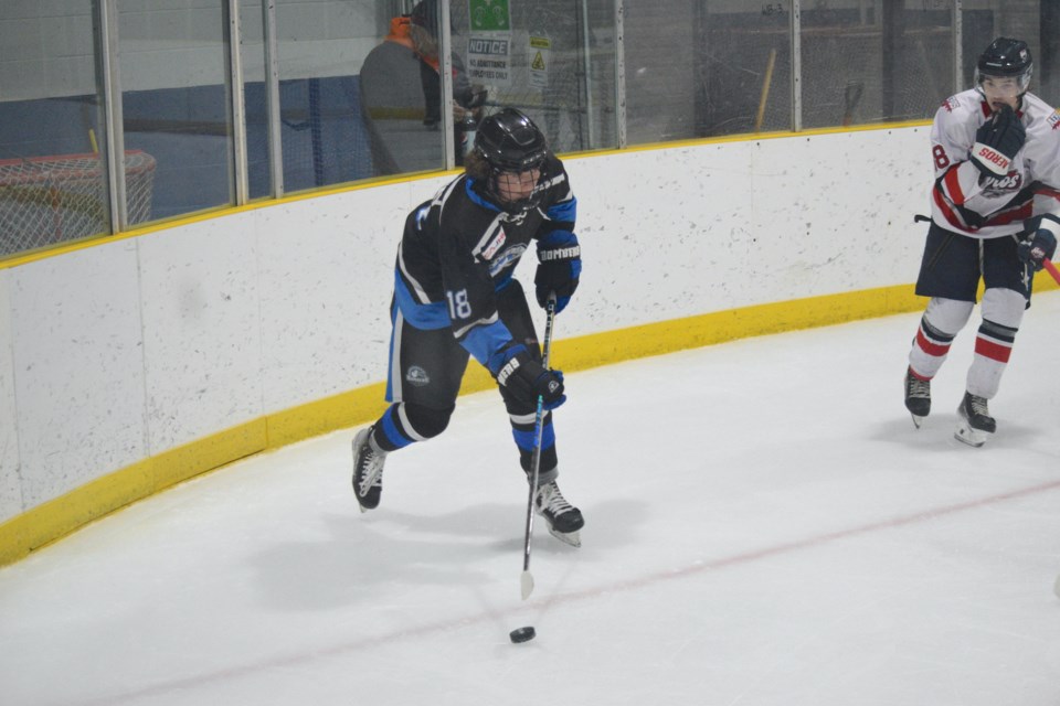 Barrhead forward Austin Galway looks for a teammate to pass to while deep in the Cold Lake offensive zone.