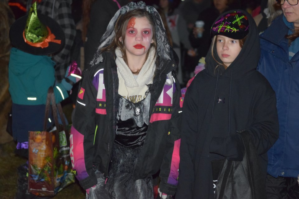 Avery Hedderswon and Layla Blaikeil coming out of one of the first booths along the path.