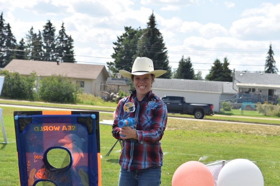 Chanel Pearson plays a B.C. Lions target game during the Blue Heron Support Association's CFL Fan Appreciation Day.