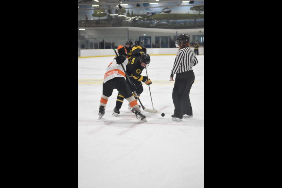 Barrhead Steeler Beckham Boswick wins a third-period offensive zone faceoff.
