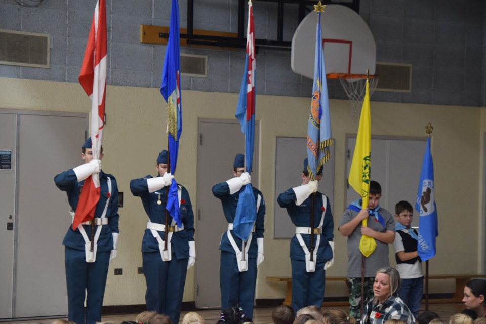 The colour guard for the BES Remembrance ceremony included members from Barrhead's Air Cadet Squadron 526 and the Scouts and Cubs.