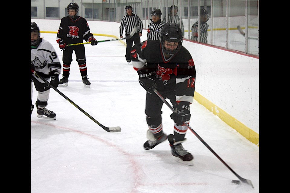 Brayden Wellon works along the boards in the first period of the Boyle U15 Blazers match against Edgerton/Chauvin at the Millview Recreational Complex in Boyle Nov. 26. Wellon had four goals in the game.