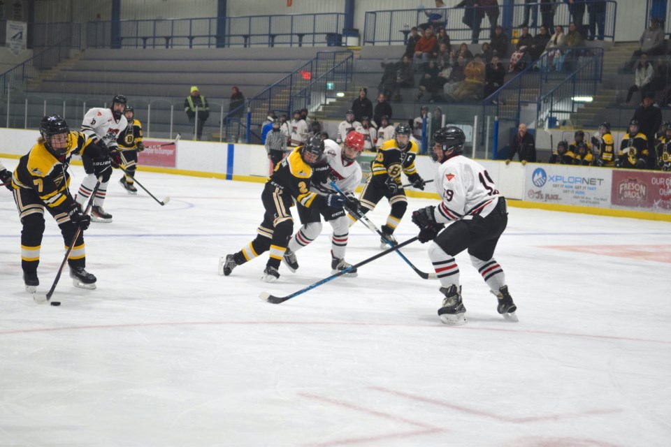 Barrhead's Beckham Bowick (left) and Mason Loffelbein (right) on a two-on-one against Whitecourt defender Jason Overeem early in the second period.