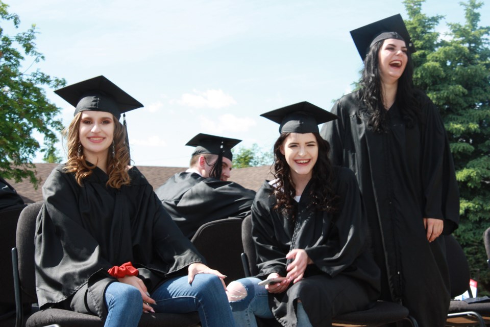 It has been a strange year for everyone, but for graduating students, a day to celebrate in the traditional way won’t come this year. They made the best of it at Boyle School June
19 though, with a celebration that saw grads paraded through town and cheered on by residents. Pictured, Katie Lynn Pisarewski, Savannah Grier and Ayva Bossell spread some cheer of their
own.

Chris Zwick/T&C