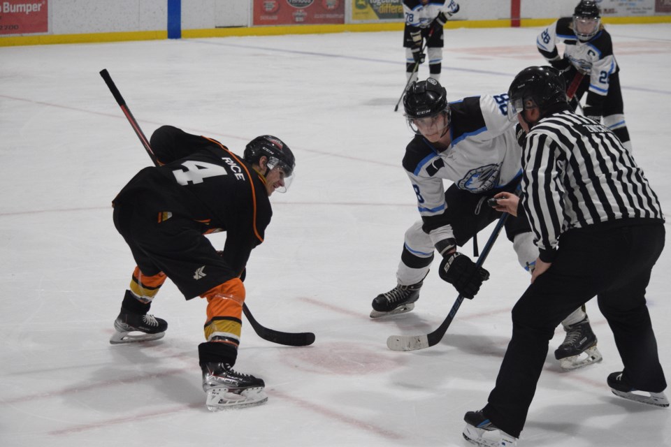 Barrhad Bomber Brandon Rose, from Entwistle, gets ready for an offensive zone face-off in the third period. 