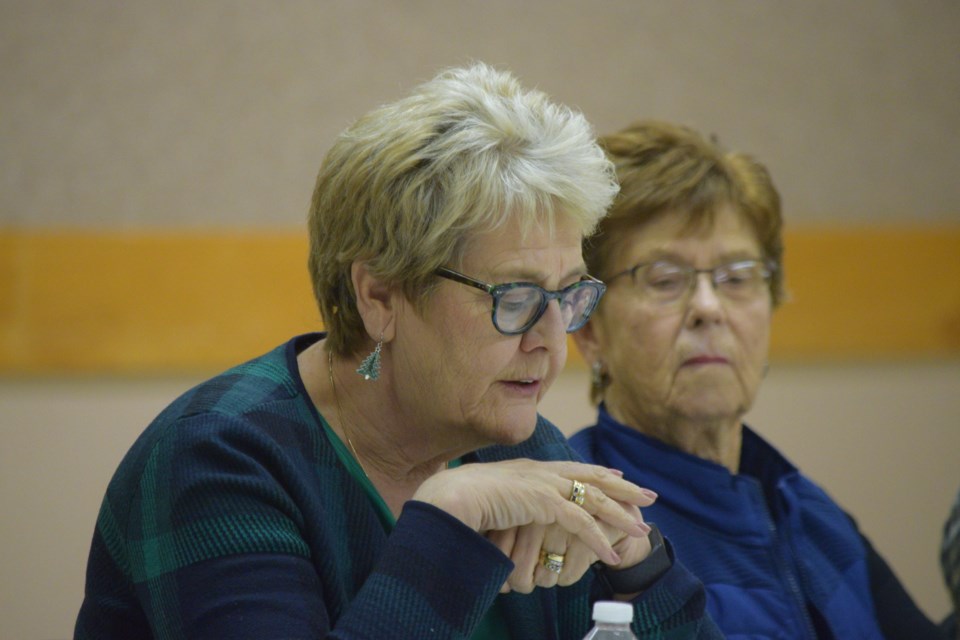 Brenda Baron chairs a community meeting about the future St. Aidan's Church which was the victim of arson on Dec. 7. Edith Strawson is in the background.