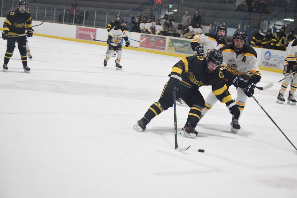 Barrhead Steeler forward Brock Beauliua powers past an Athabasca defender on his way to the net. Beauliua finished the game with two goals.