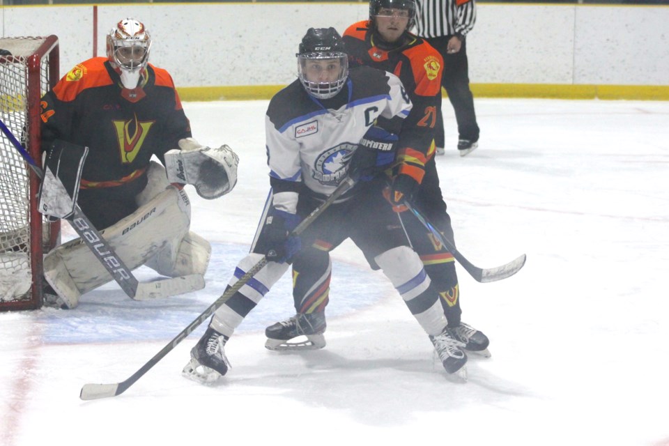 Barrhead Bombers captain Cade Bohn fights for position with his Vegreville Viper opponent Colby Warawa late in the third period.