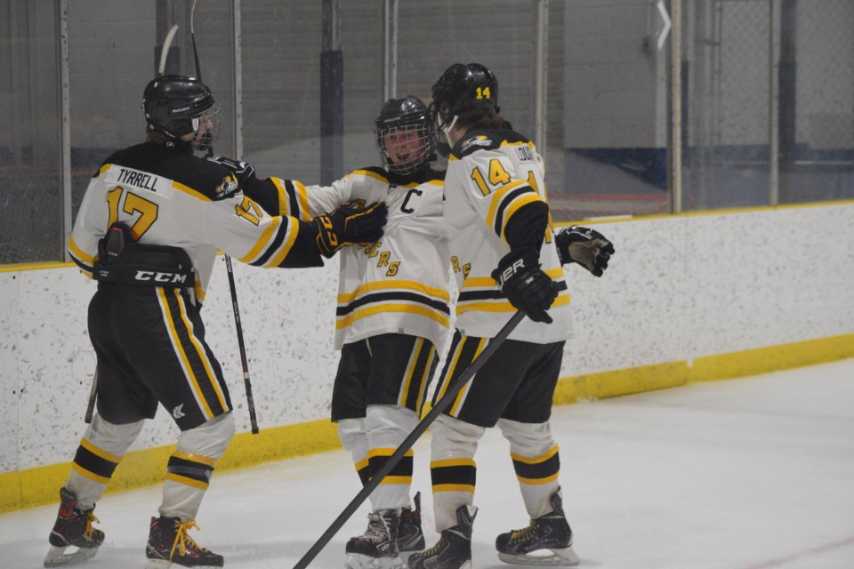 David Tyrrell (left) and JW Loughran (right) celebrate Kolby’s Miller’s (middle) goal which made the score 8-1 for the Barrhead Steelers.