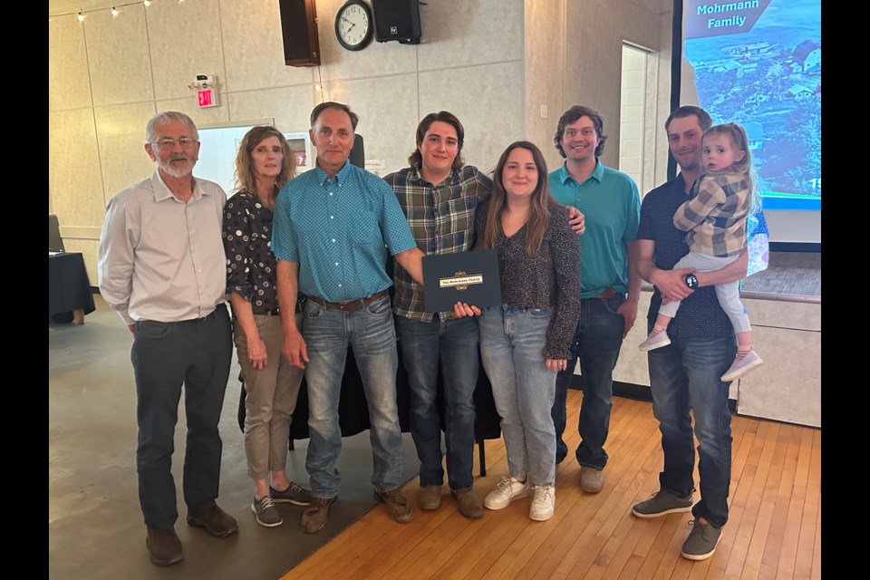 The Mohrman family, whose farm celebrated its 114th anniversary in early April, were the recipients of this year’s Alberta Century Farm Award at the County of Barrhead Appreciation Dinner on April 23 at the Summerdale Hall. Presenting the award at left is Coun. Walter Preugschas. To the right are Renee, Patrick and Mikael Mohrmann; Natash and Alekz Moes; and Nolan and Dallas Schmidt. Missing are Sierra and Miller Schmidt.