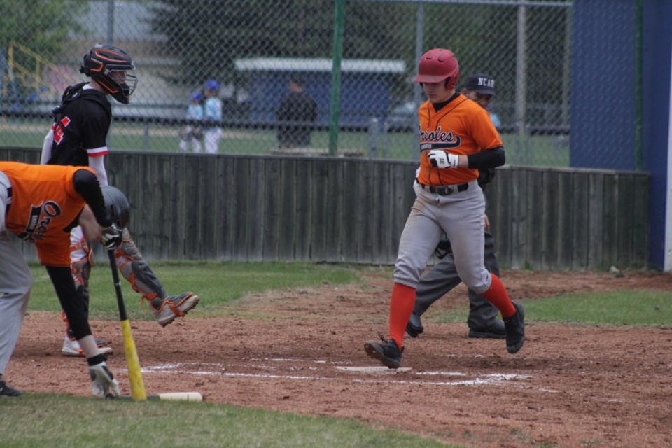 Chase Visser crossing home plate in the fourth inning.