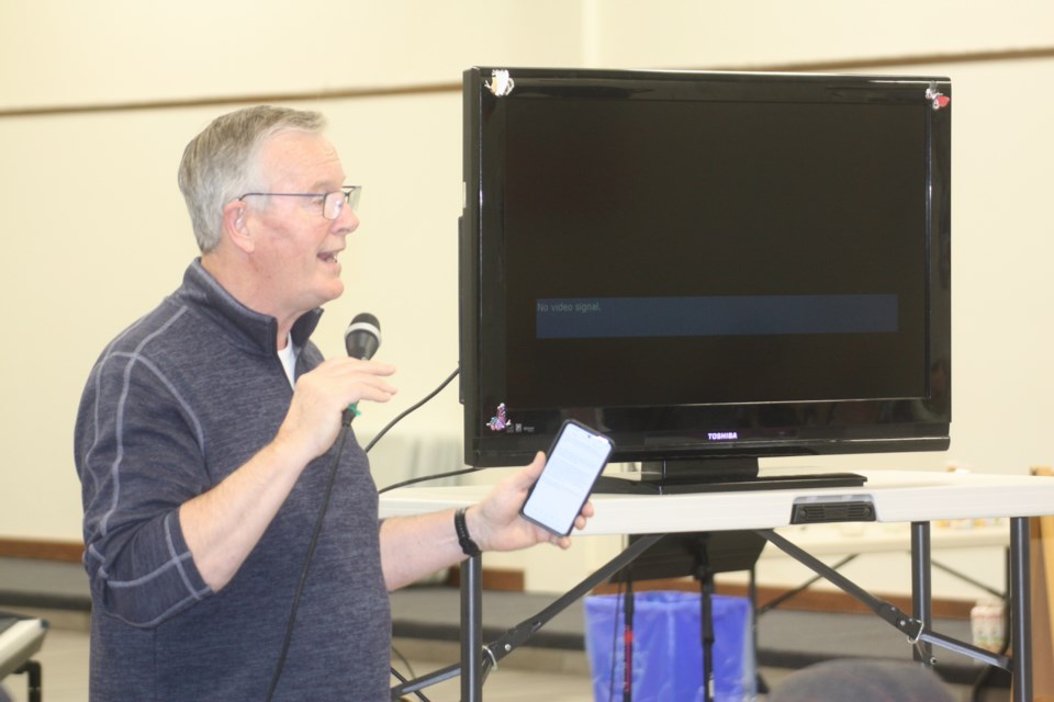 Rick Scruggs with the Lifeline Christian Mission talks to the crowd at the April 6 fundraiser about the crisis in Haiti. Scruggs also played a video message from missionary Ricot Léon, who has spoken at past fundraisers for Lifeline's mission in Haiti.