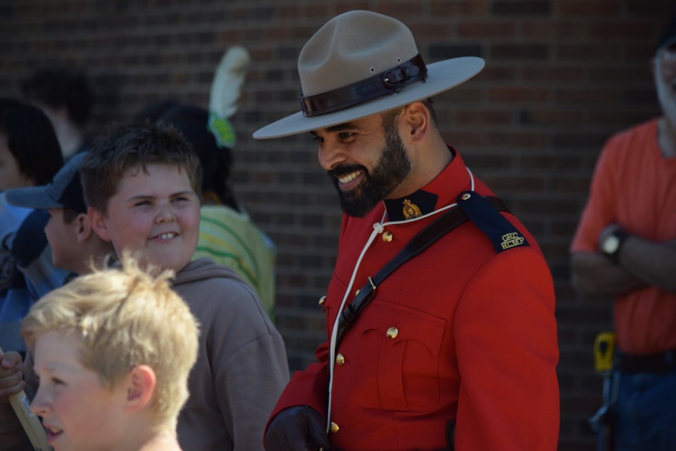RCMP Const. Ashish Ralh talks to some youngsters before heading out on the Walk of Reconciliation as part of Barrhead's National Indigenous Peoples Day festivities on June 21.