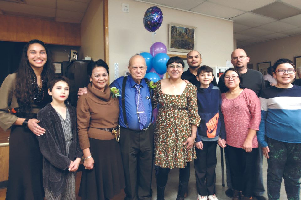 Family, friends, colleagues, patients and other well-wishers gathered at the Athabasca Seniors Centre Nov. 17 to welcome longtime area physician Dr. Michael J.W. Smith into retirement after 51 years in the profession, and 43 of those in Athabasca and
Boyle. Pictured, L-R: daughter Fiona Willoughby, granddaughter Bella Willoughby, wife Evelyn Smith, Dr. Smith himself, daughter
Micaela Smith, son Ian Smith, grandson James Willoughby, son Daniel Smith, daughter in-law Anabelle Smith and grandson Philippe Smith.